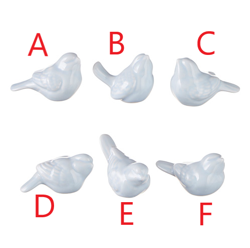 Ceramic bird figurine with a natural brown finish and smooth rounded silhouette.