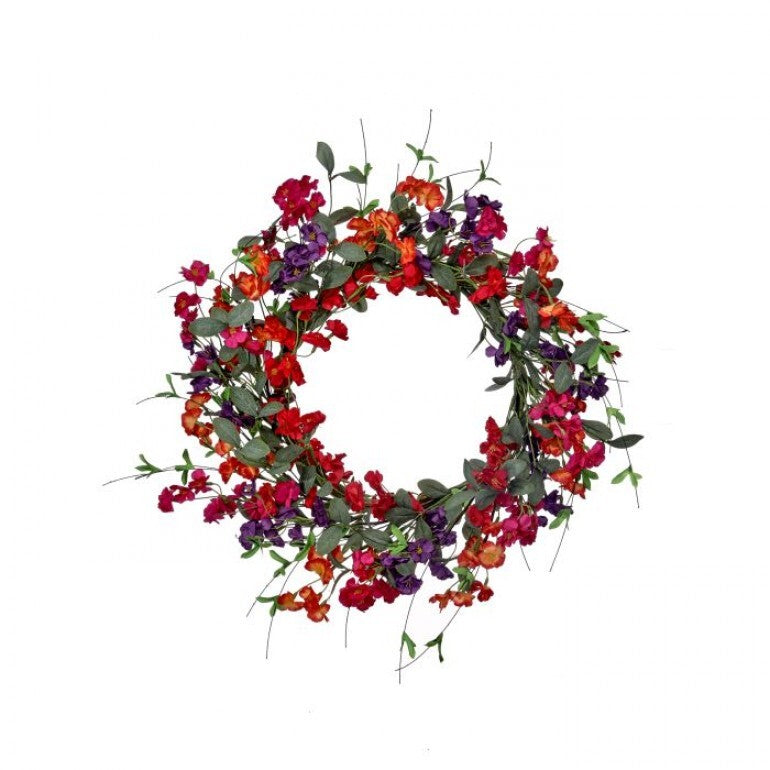 A round wooden garden wreath featuring a floral blossom design with greenery accents.