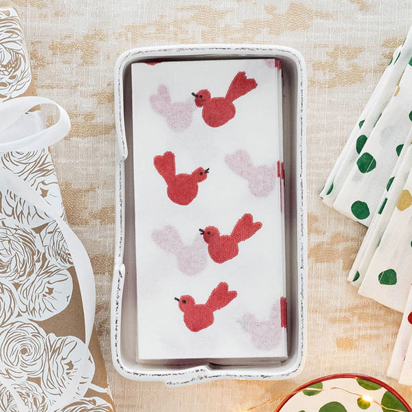 Papersoft guest towels featuring a red bird pattern in a white rectangular tray.