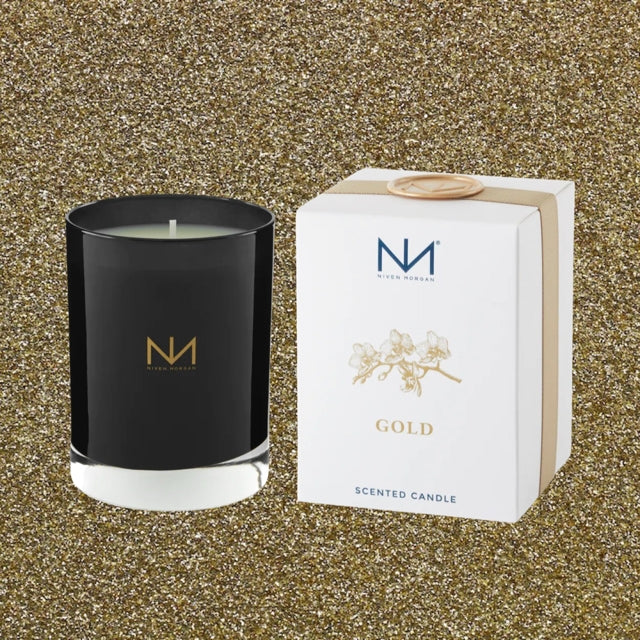 Dark navy glass soy candle with gold accents