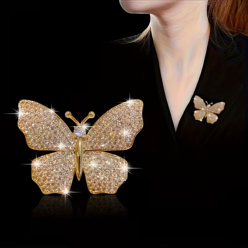 Golden-tone rhinestone butterfly brooch with elegant open-winged silhouette