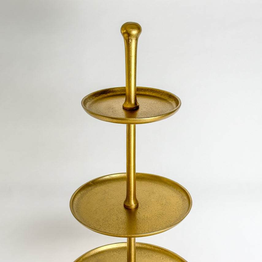Gold 5-tier metal stand with round textured trays and a central support pole.
