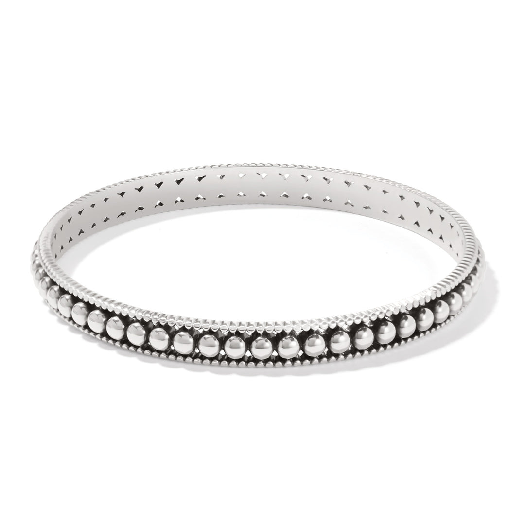 Silver plated slim bangle with symmetrical pierced channel beads and linear textured sides.