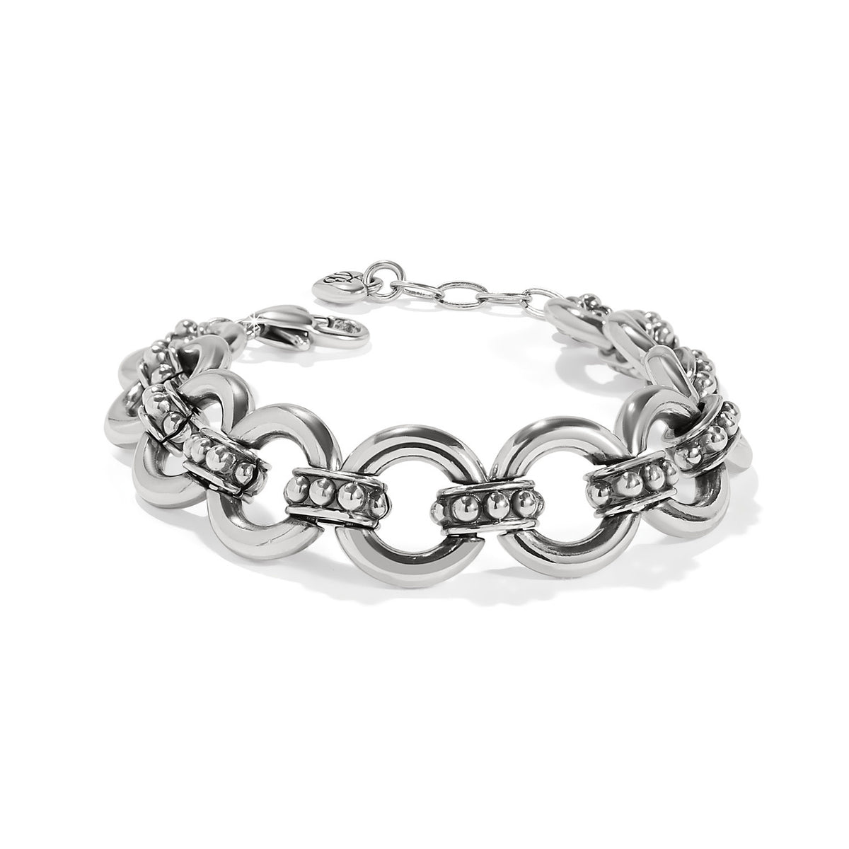 Silver plated adjustable stud link bracelet with ten smooth rings connected by sculpted beaded links.
