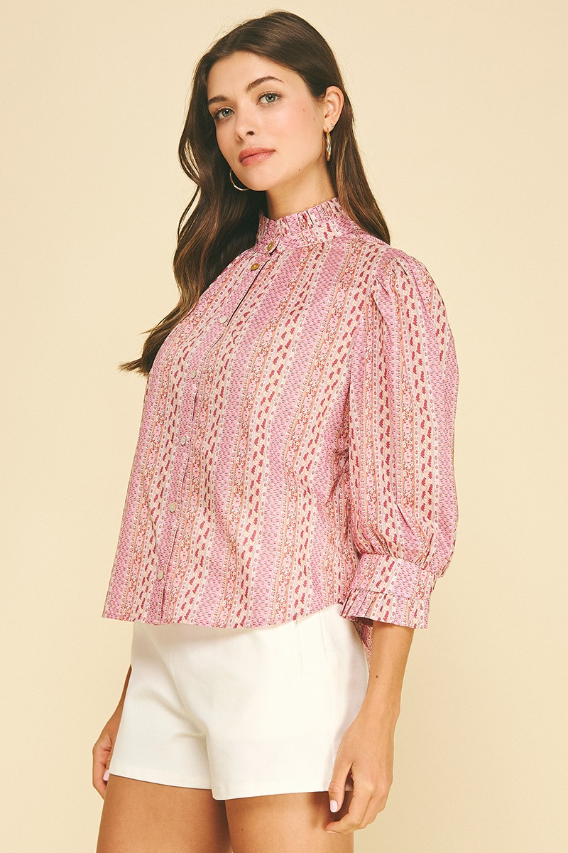 Woman wearing a pink Mabel Floral Botanical Print Button Down Blouse with white shorts.