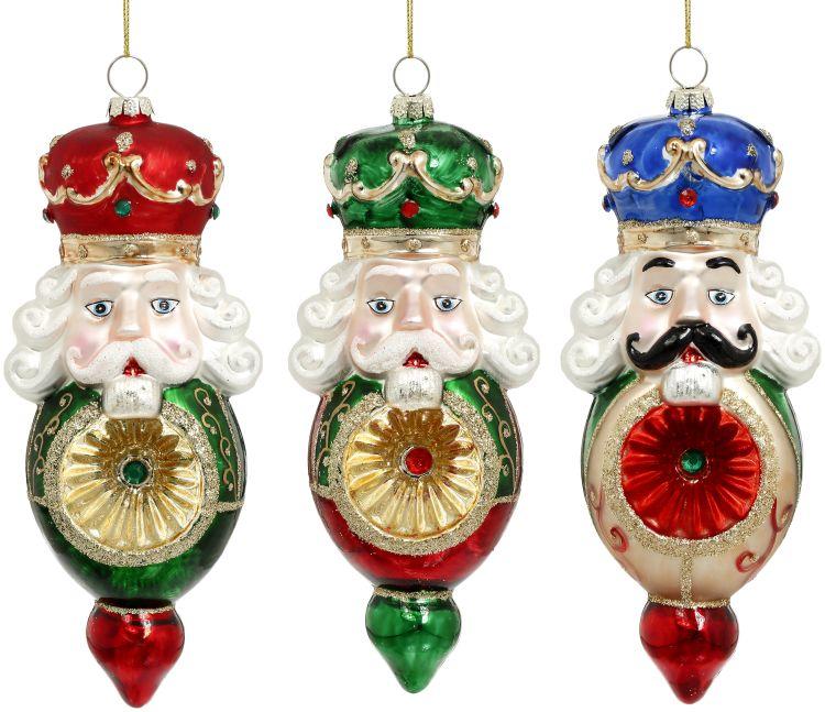 Hand-painted glass nutcracker ornament with witch's eye effect eyes, standing seven inches tall.