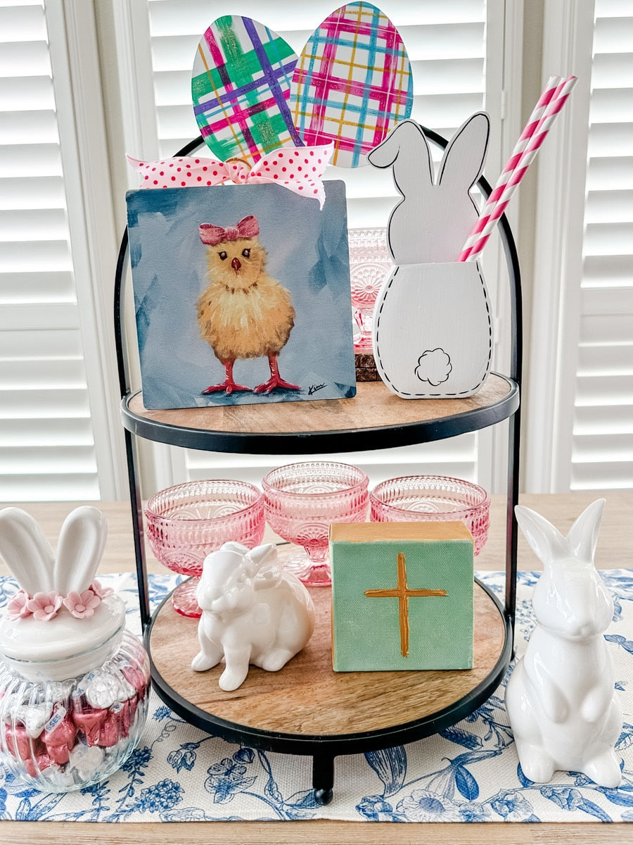 Pink Kross bow-shaped chick ornament with a hanging loop