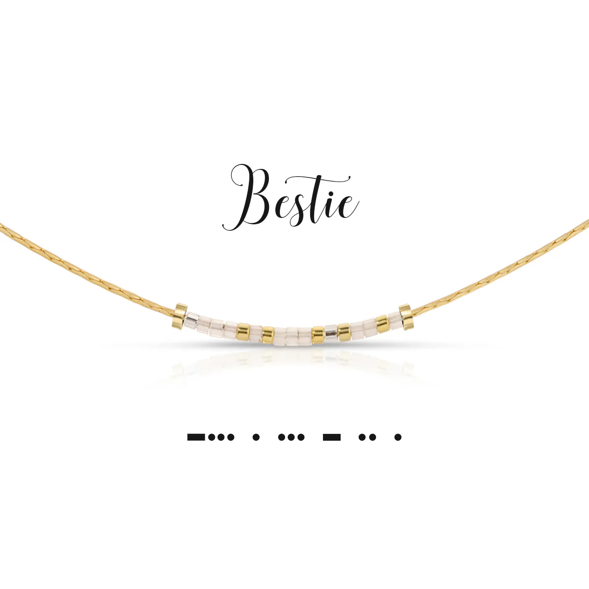 Gold chain necklace with white and pewter beads spelling Bestie in Morse code.