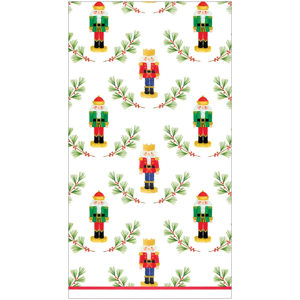 Little Nutcracker guest towel featuring a pattern of nutcrackers and pine branches with red berries.