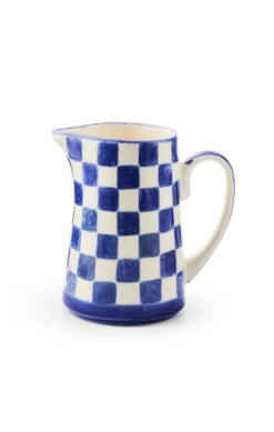 Blue and white checkered ceramic pitcher with a handle and spout.
