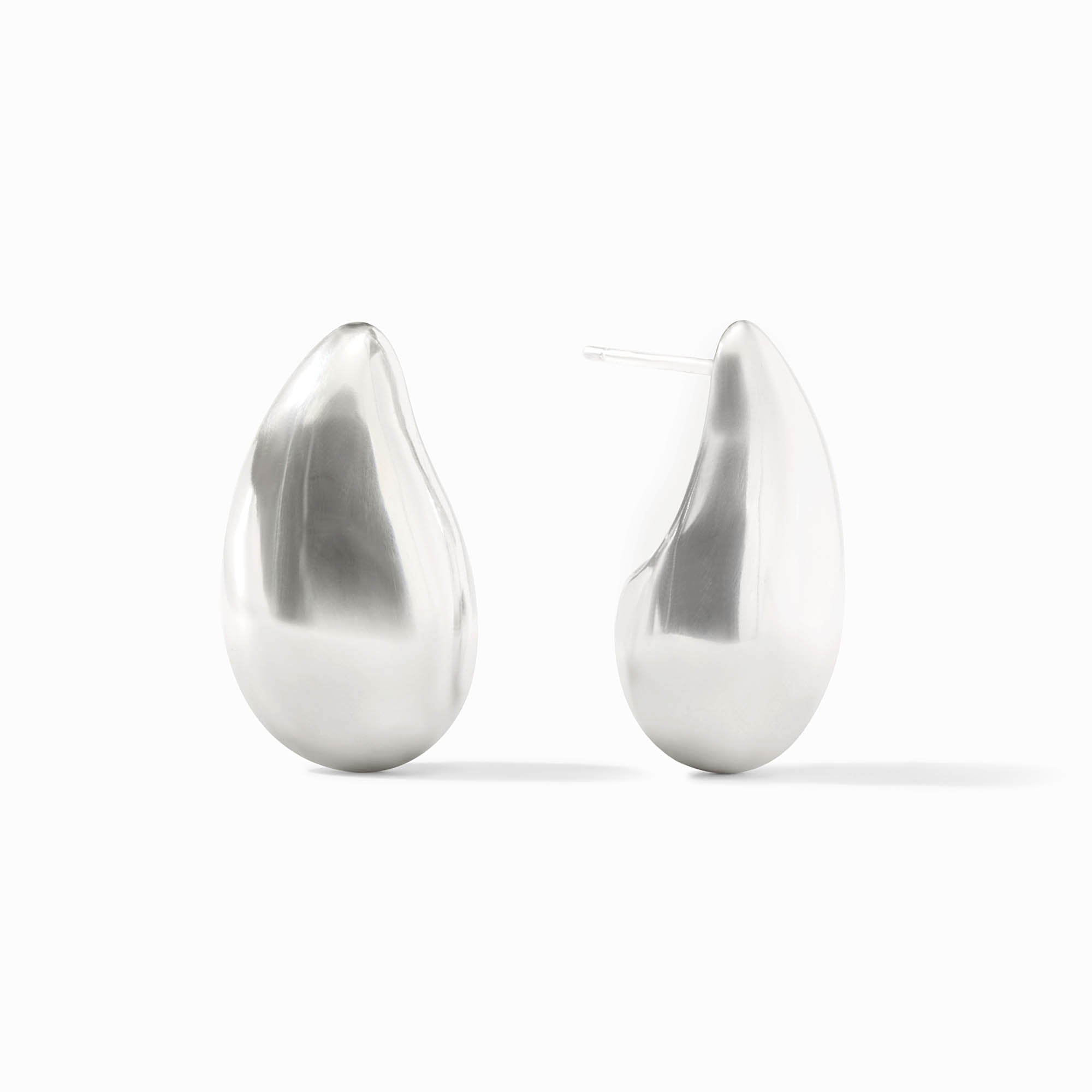A pair of silver Wave Earrings with a smooth, polished teardrop shape and post backs.