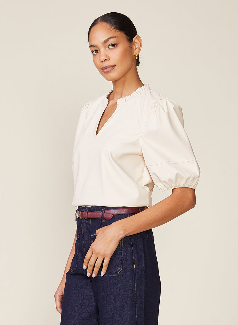 Kacey vegan leather blouse in black with viscose panels featuring a relaxed silhouette.