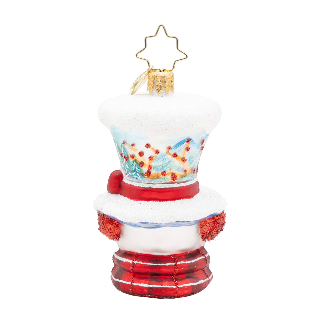 Snowman ornament with a hand-painted winter scene, snowy hat, red mittens, and a plaid base.
