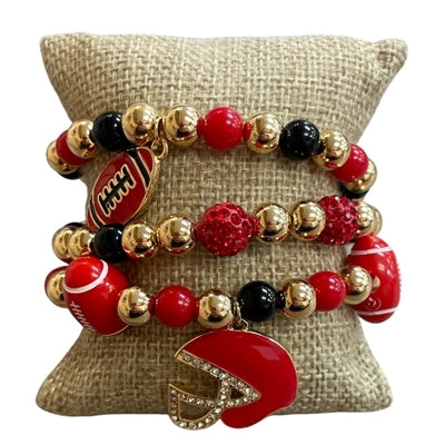 Set of three red, black, and gold beaded stretch bracelets with football and helmet charms.