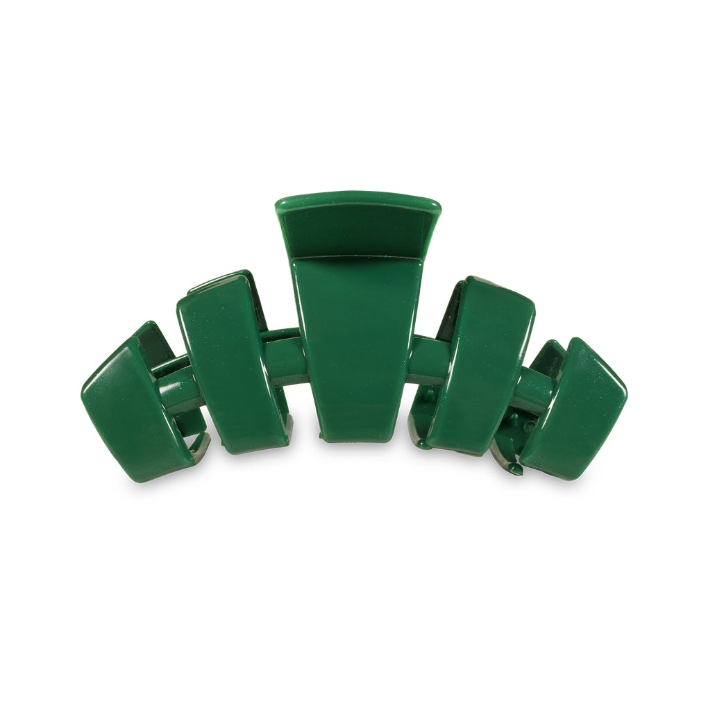 Medium-sized classic hair clip in a neutral tone with an open comb design.