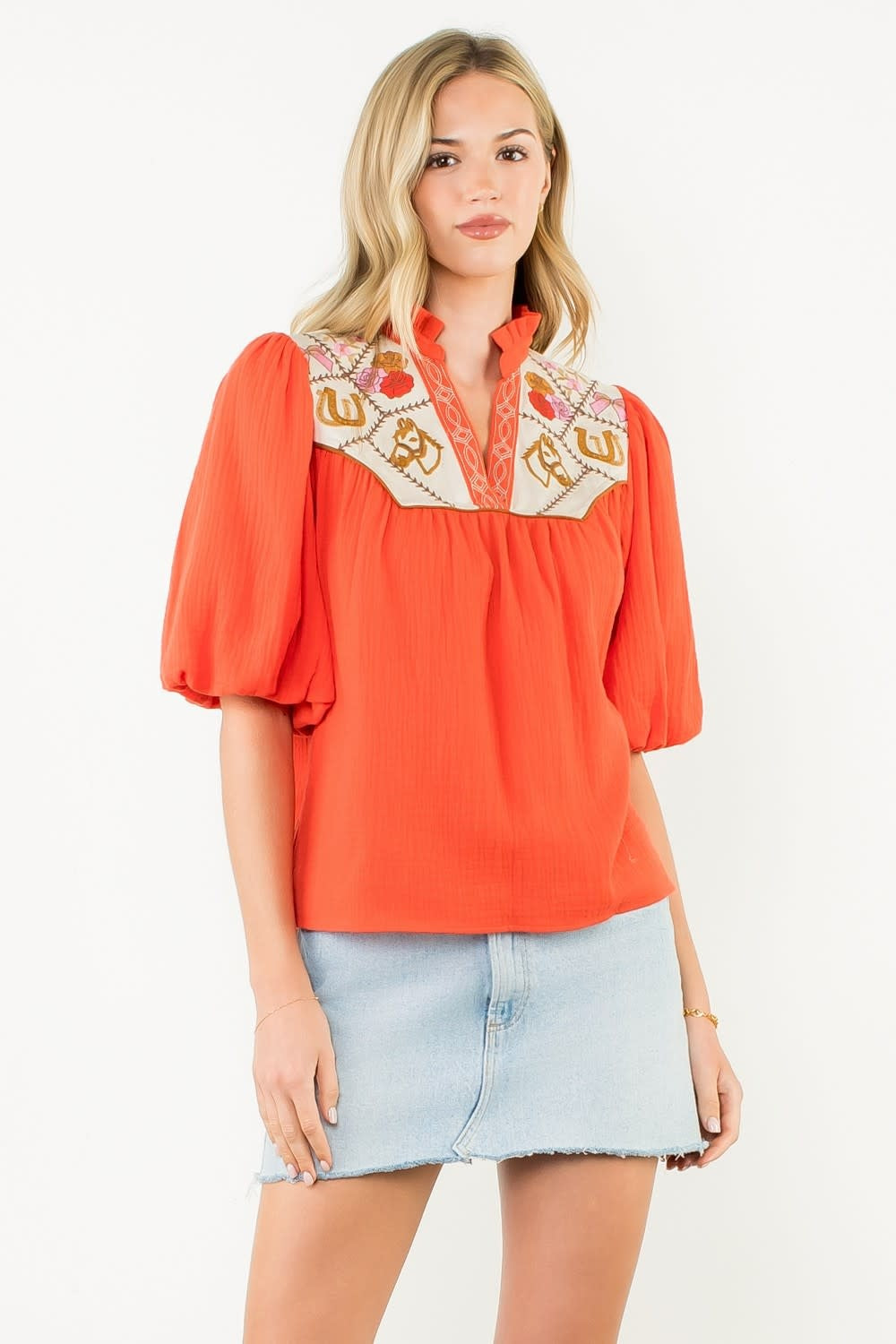 Women's white cotton top with puff sleeves and embroidered neckline