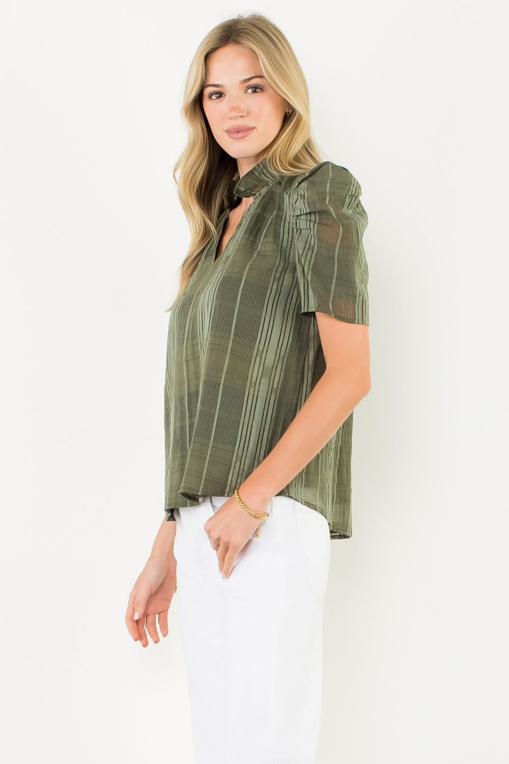 Side view of Eunice gingham textured V-neck top with puff sleeves in woven rayon and polyester blend.