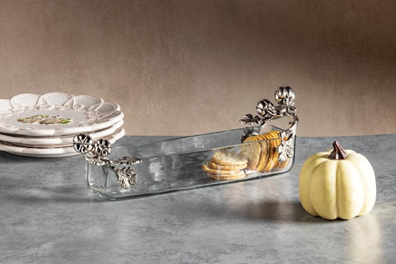 Glass cracker dish with cast aluminum pumpkin handles in autumn orange.