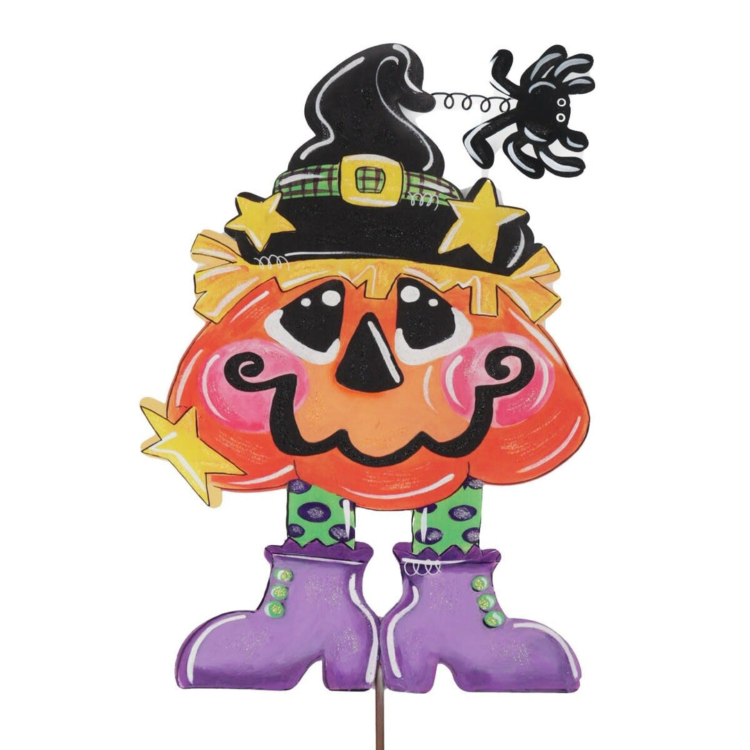 Stake pumpkin witch figurine with black hat, orange body, green stem, and white face details.