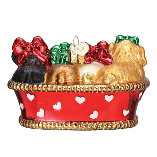 Back view of a Puppies In A Basket ornament showing three white puppy figures in an open basket.