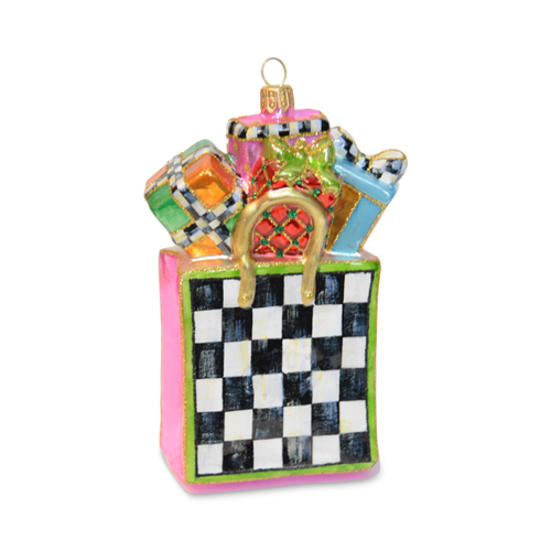 Glass Christmas ornament of a checkered shopping bag filled with colorful wrapped gifts.