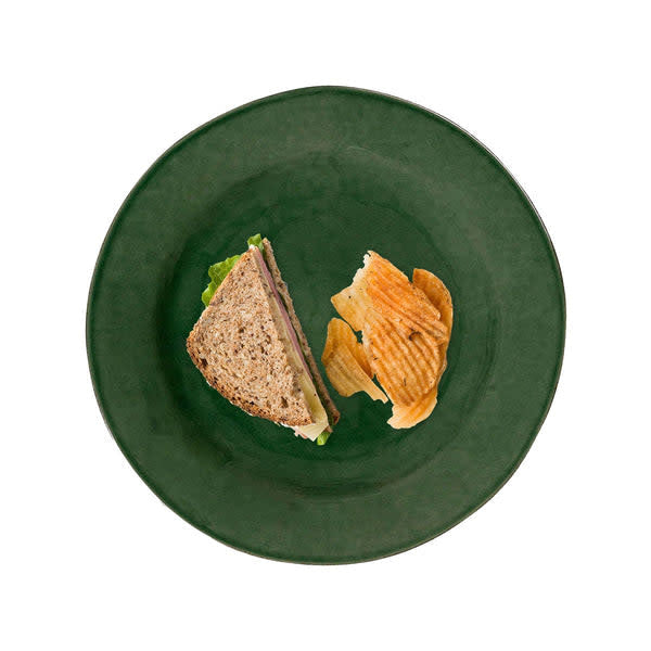 Puro ceramic dessert plate in basil green with a smooth glazed finish.