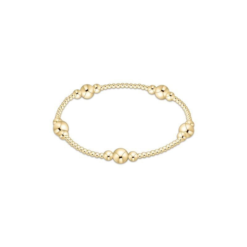 Polished gold bead bracelet with a sleek, radiant finish.