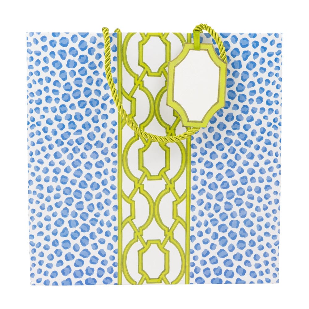 Medium square gift bag with blue leopard spots and a green geometric trellis center stripe.