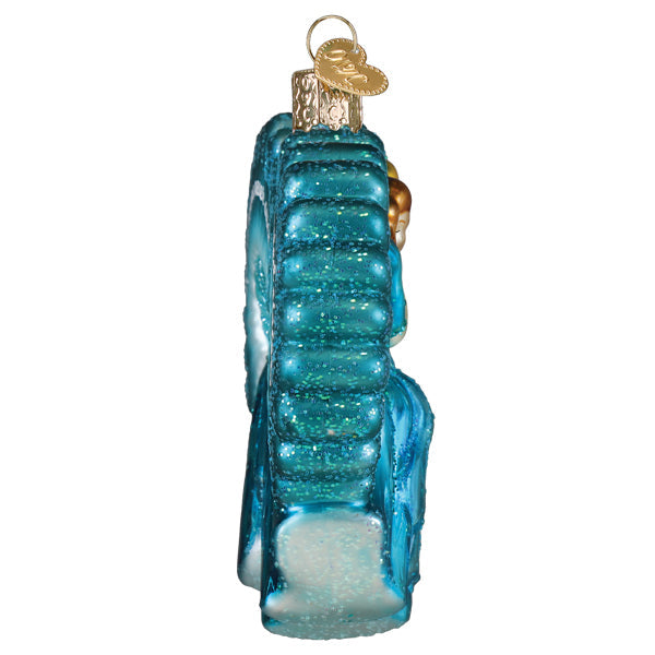 Side view of a blue glittery glass Sisters Sisters Christmas ornament with a gold heart charm.