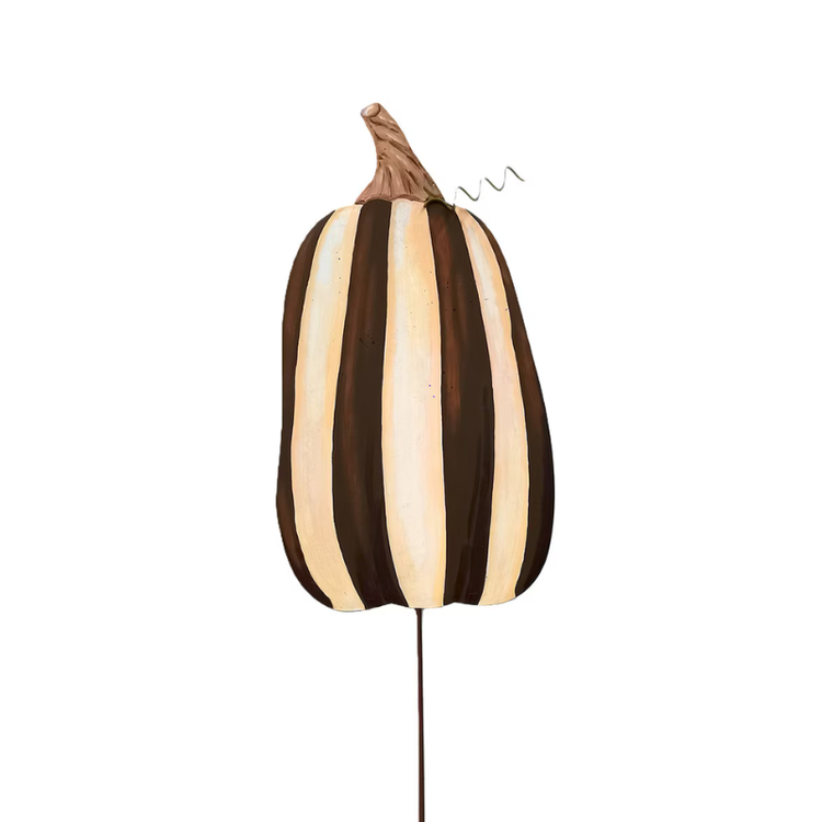 Metal striped pumpkin garden stake in chocolate brown and cream with a textured stem.