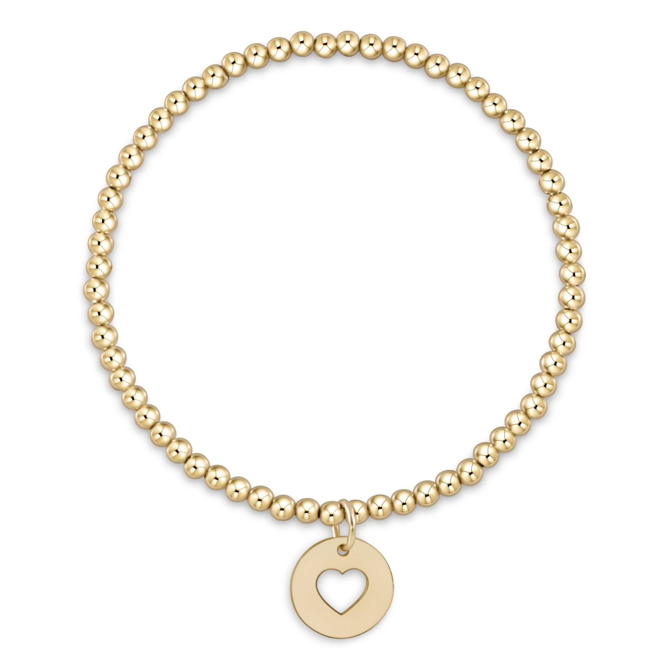 Classic gold 3mm bead bracelet featuring a circular gold disc charm with a heart cutout.