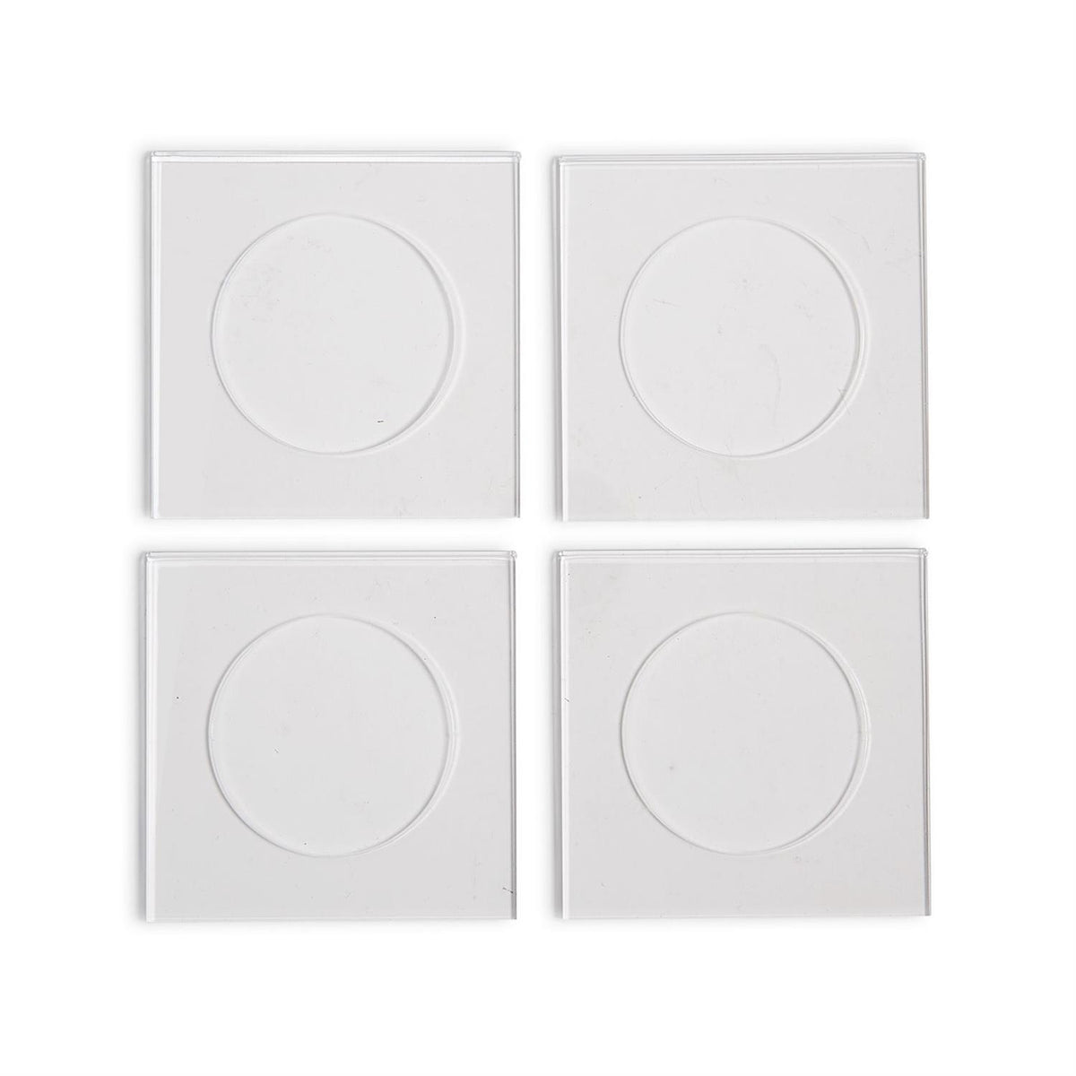 Set of four square clear acrylic cocktail coasters with circular center indentations.