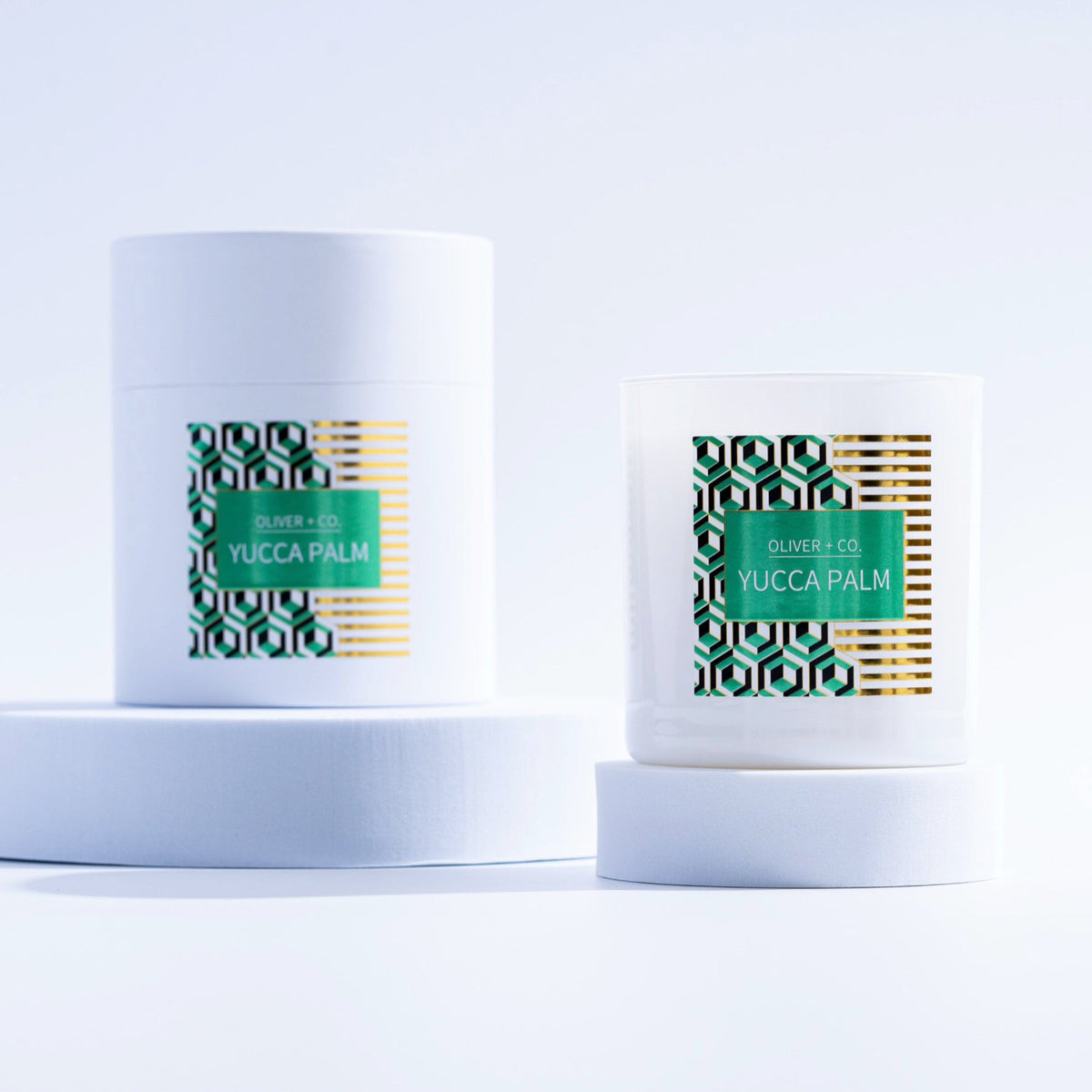 12 oz Signature Candle in Yucca Palm scent with matching white cylindrical packaging.
