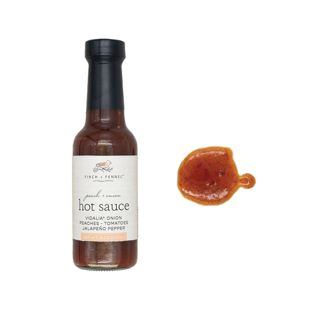 A 5oz bottle of Finch + Fennel Peach + Onion Hot Sauce next to a sample of the sauce.
