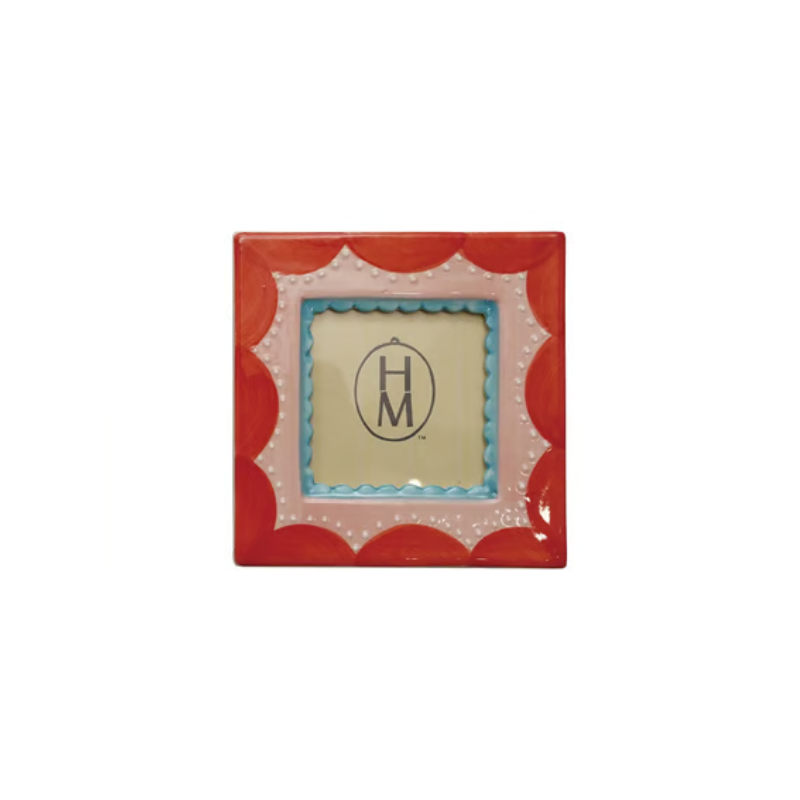 Square stoneware photo frame with red scalloped edges, pink center, and blue inner border.