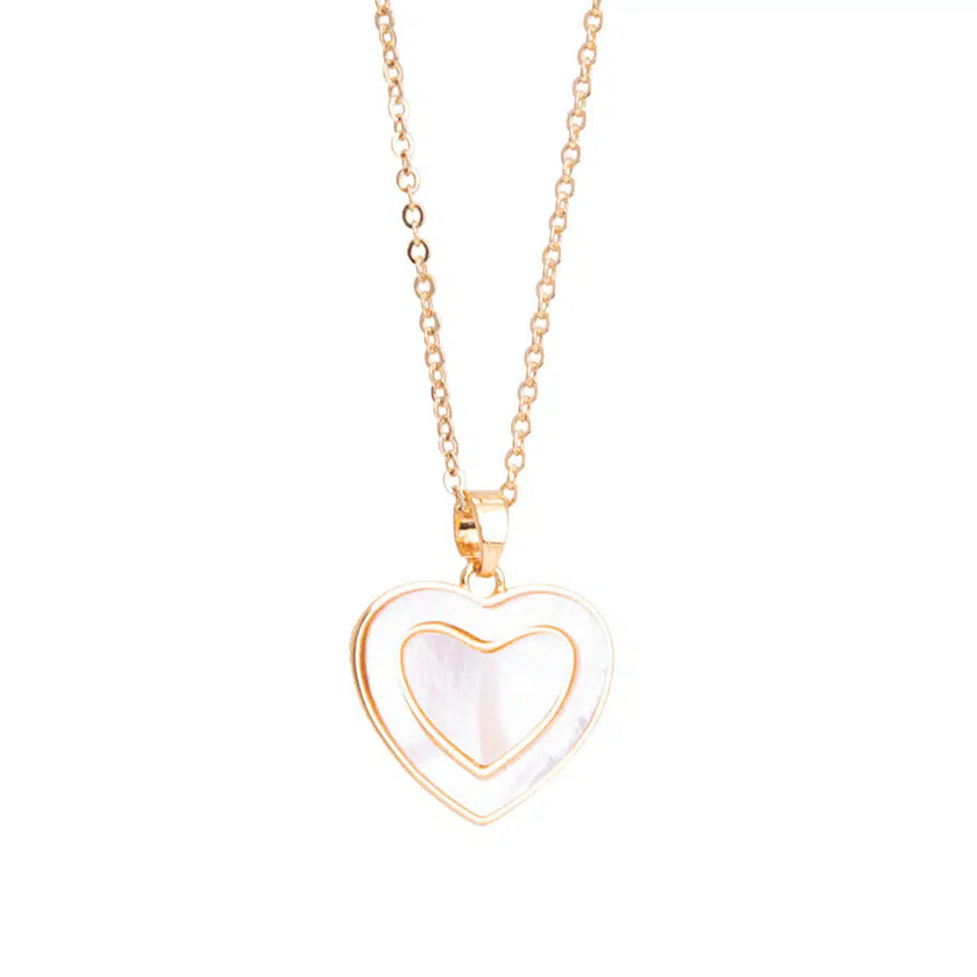 Gold necklace with a double-layered heart pendant featuring a white mother of pearl inlay.