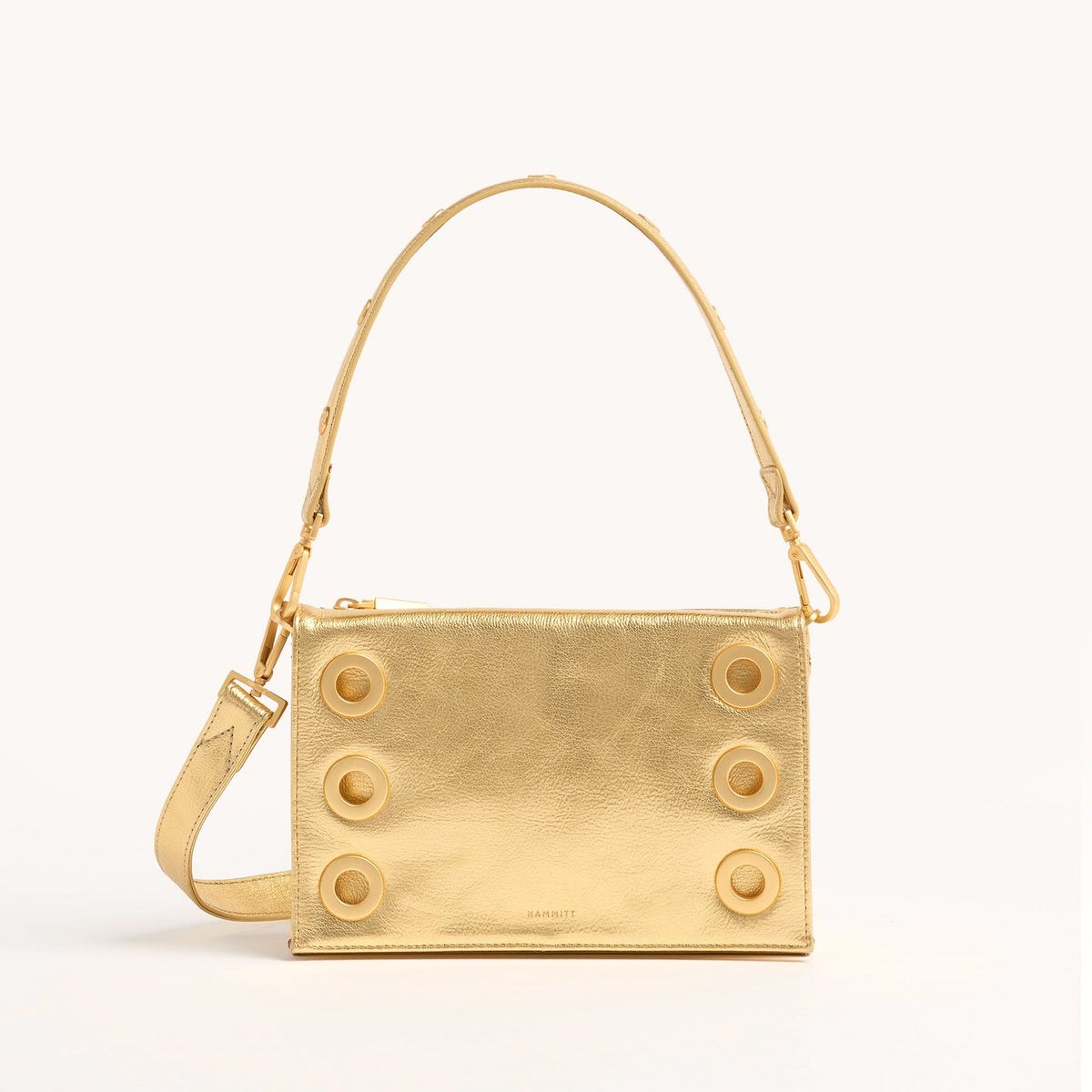 Small Montana Revival clutch in vintage leather with Hammitt strap, magnetic closure, and red reveal base.