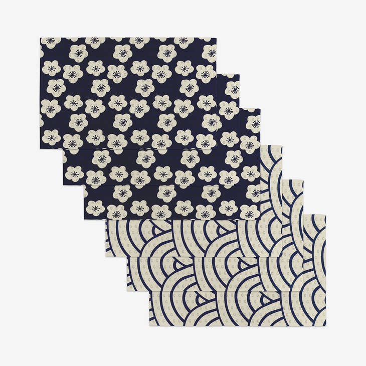 Set of reusable kitchen towels made from post-consumer recycled materials in a neutral tone.
