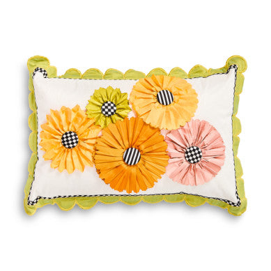 Scalloped lumbar pillow with a spring bouquet floral print on polyester fabric.