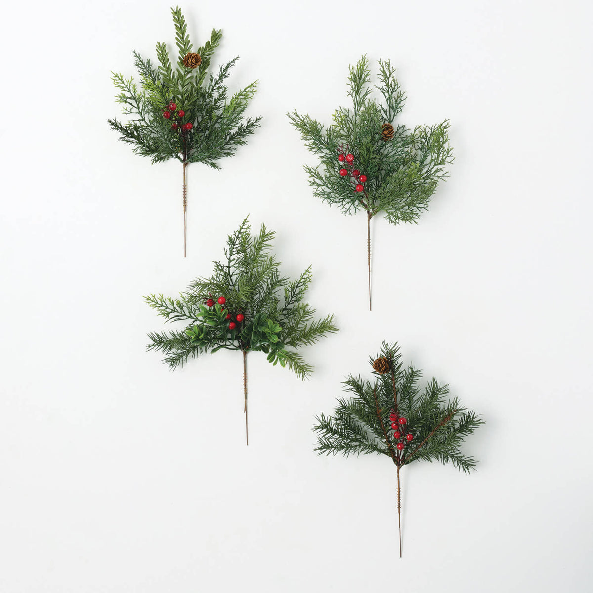 Mixed pine cedar pick arrangement featuring green foliage and brown cones in a natural evergreen style.