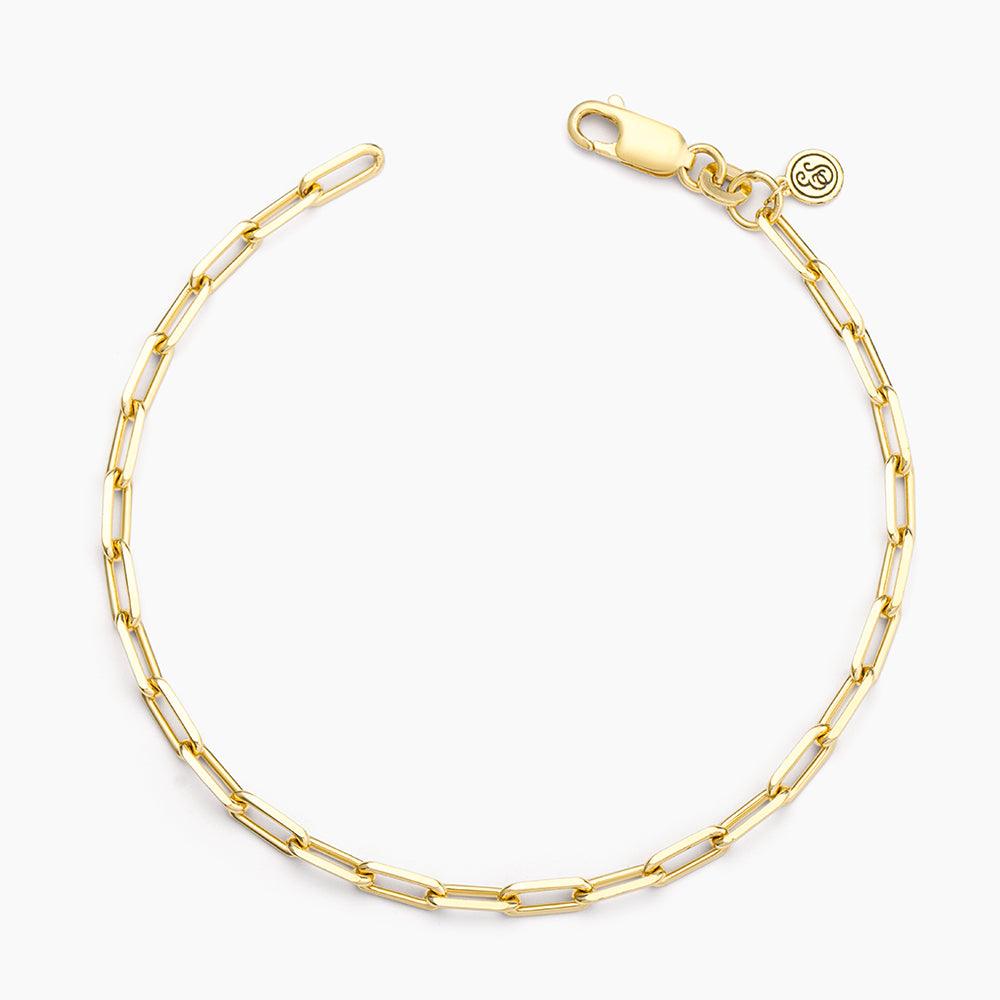 Mini paper clip chain bracelet in silver metal with a lobster clasp closure.
