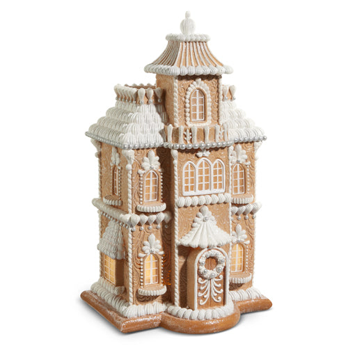 24-inch lighted gingerbread house with white icing details, pearl accents, and glowing windows.