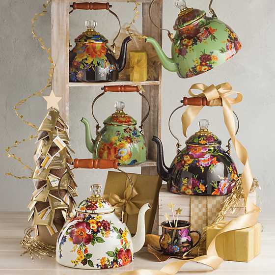 White Flower Market tea kettle with hand-applied floral decals on steel body, wood handle, and glass lid finial.