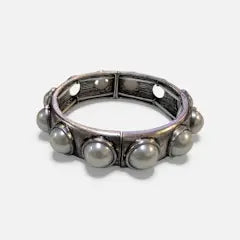 Pearl stretch cuff bracelet featuring faux pearls in a solid white finish.