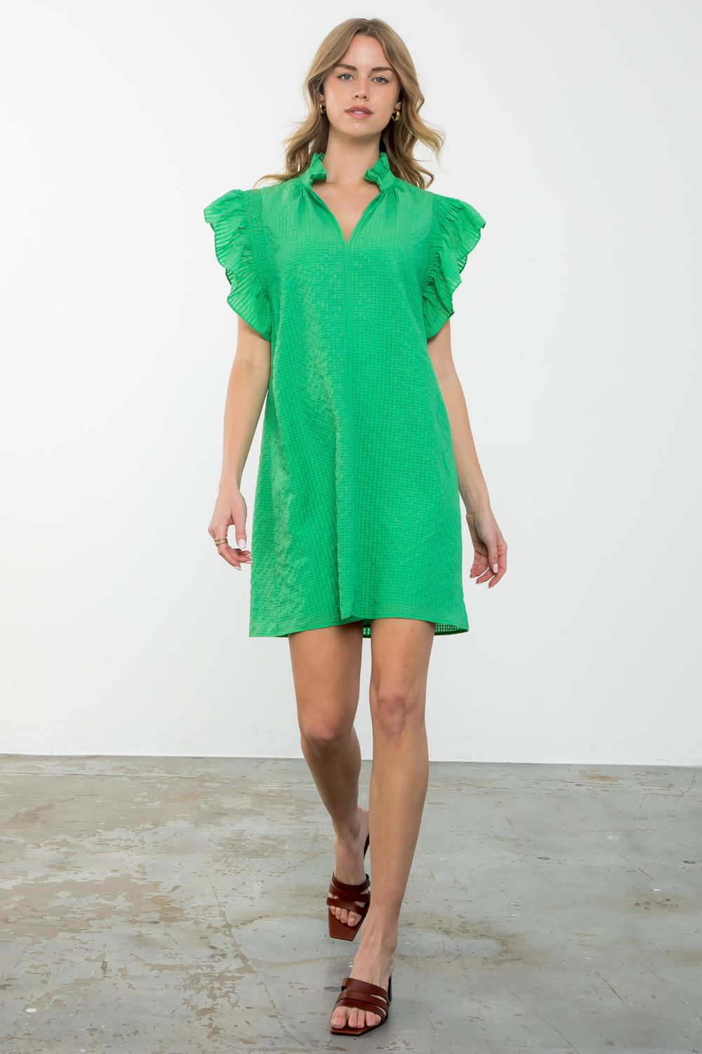 Women's Isabella dress in woven polyester with ruffle sleeves and a textured silhouette.