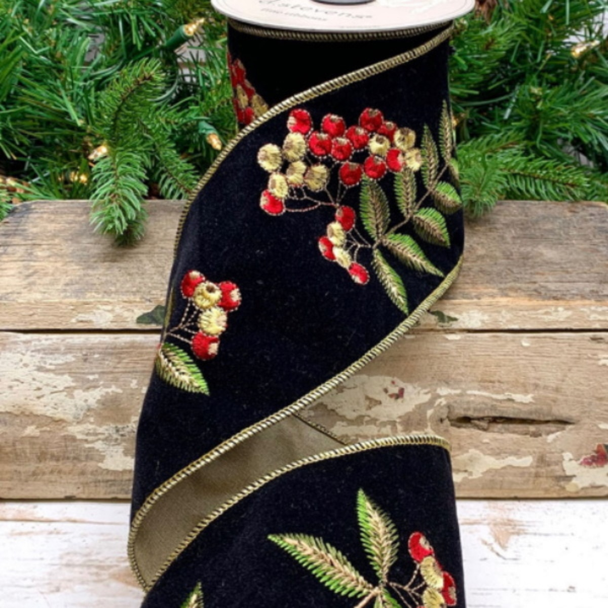 Black velvet ribbon with embroidered red and gold pyracantha berries and green leaves.