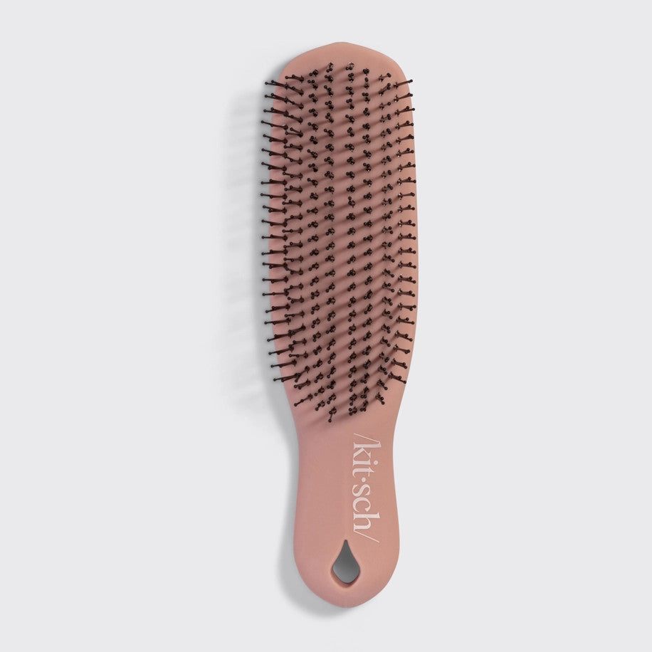 Terracotta Scalp Renewal Brush with multi-level bristles and ergonomic handle
