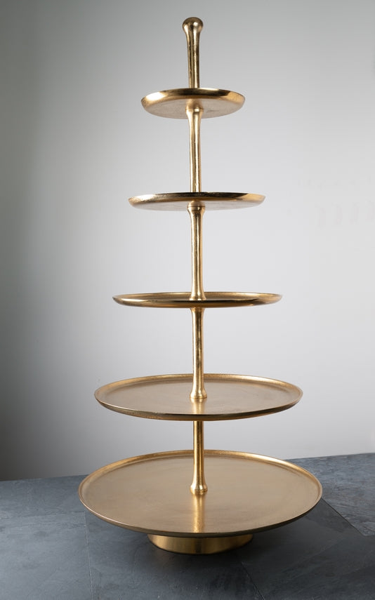 Gold 5-tier metal serving stand with round trays of varying sizes on a central spindle.