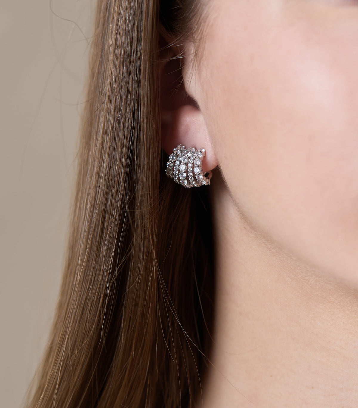 Maeve Quintuple Hoop Earrings in gold-tone metal featuring five stacked circular hoops with a sleek silhouette.