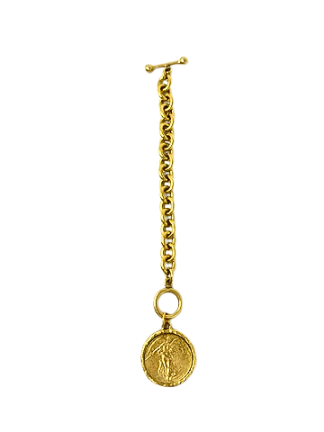 Gold link bracelet featuring a toggle clasp and a round Liberty coin pendant.